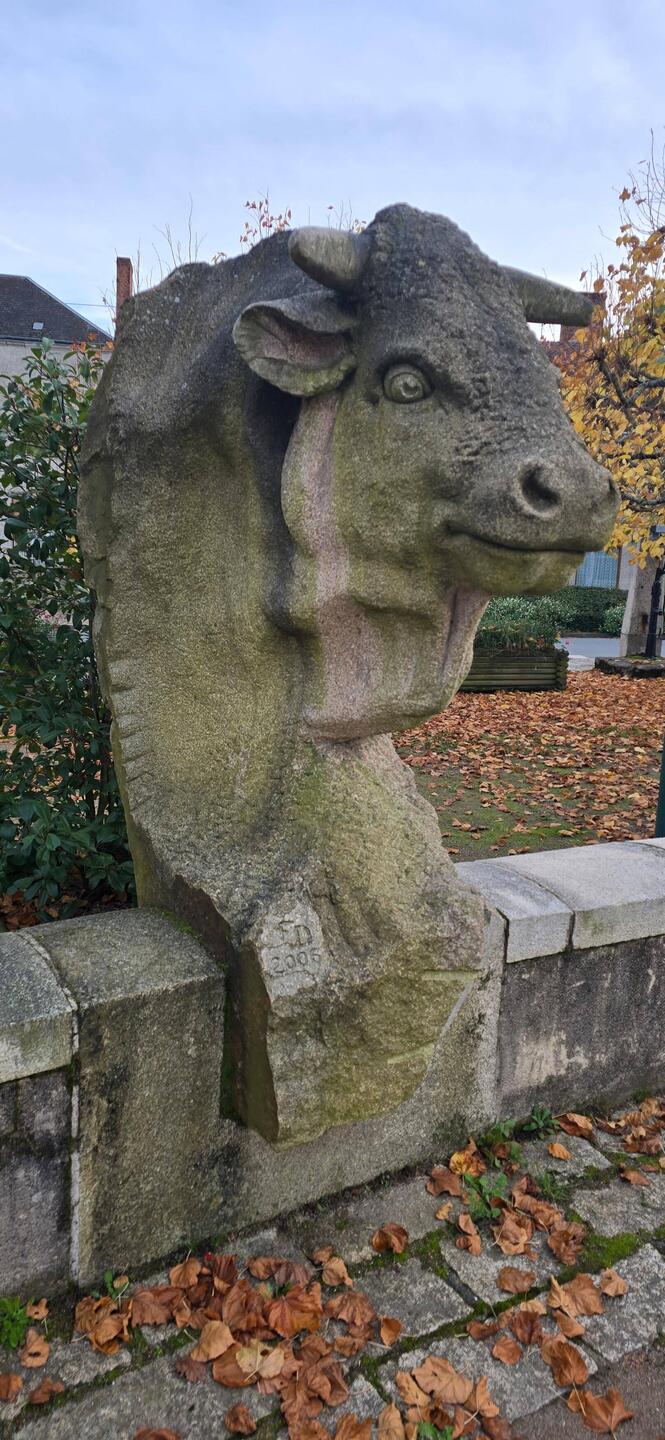 Cow sculpture in the town square representing this farming community