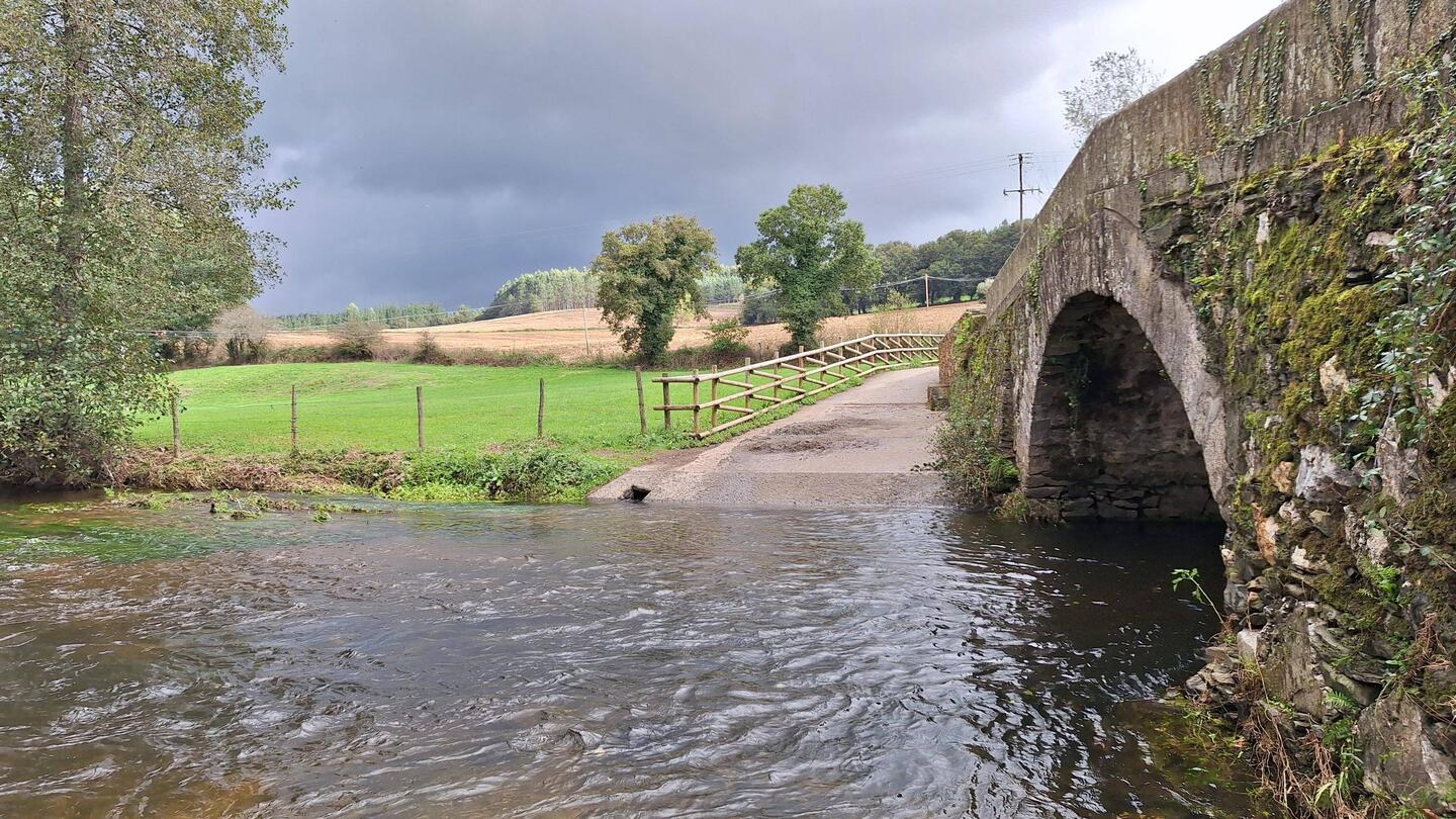 Over the final bridge and just ahead of the menacing looking cloud.