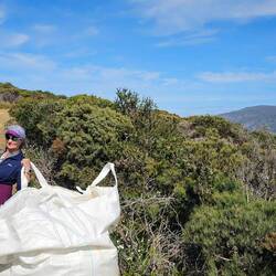 They airlift bags of rocks to maintain the trails