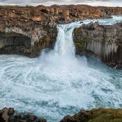 Aldeyjarfoss is an impressive waterfall in a unique setting of basalt columns and rock caves.