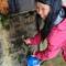 Joyce collecting water from La Font Vella