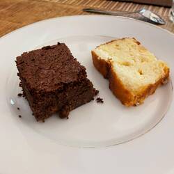 Dessert was a piece of chocolate cake and a piece of coconut cake