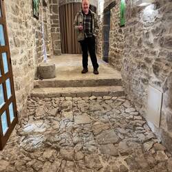 Ian admiring the ancient Roman road discovered under the floor