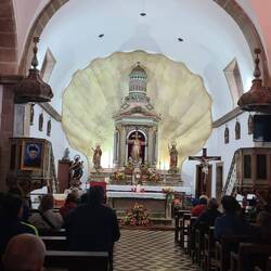 Was surprised to see the huge shell design behind the alter.