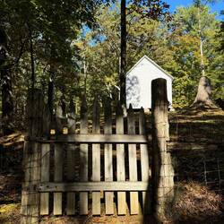 A gate tells me the road used to service the church. Although main entrance is up front