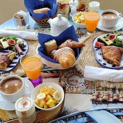 Breakfast was enjoyed despite the rainfall. We just backed up the table towards our door!