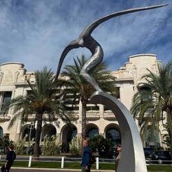 Casino, statue of man getting energy from the wave