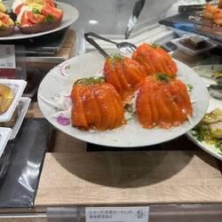 Smoked salmon with herbs on a bed of salad