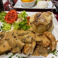 Chicken with a mushroom sauce and potatoes dauphinois