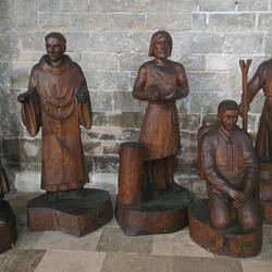 Carvings representing various ages of the Abbey from the crusades to the modern pilgrims