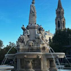 Eglise St Perpetue and Fontaine Pradier, the woman represents the town of Nimes