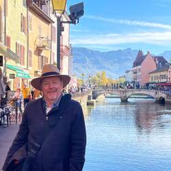 Ian with the canal, lake & alps