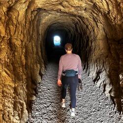 CJ walking through the tunnel to the middle level of the Pont