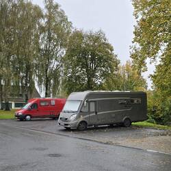 Aire on edge of town, with services. Close to main road and bus station (so not the quietest)