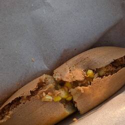 Crispy on the outside, then filled with ground peanuts, sugar, bit of butter and sometimes sweetcorn
