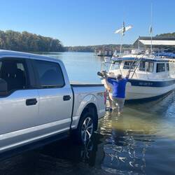 Putting the bow ladder back up I used to get down. Dock is NOT next to the ramp.