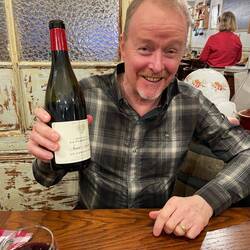 Happy with his wine choice