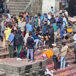 Covering their loved one with marigolds
