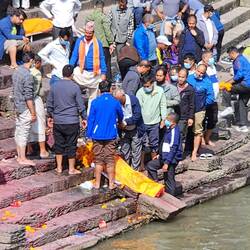Women are inside temples, men give their final blessings, later women walk through streets