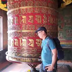 Kelly walking around the prayer wheel
