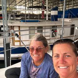 Enjoying some peanut butter whiskey on the bow of Paradise Bound. Donna's photo