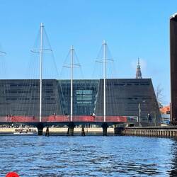 The bridge built to resemble a ship with the Black Diamond (Library) behind