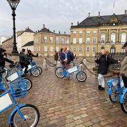 The group hearing about Amalienborg, palace and home of the Danish Royal Family
