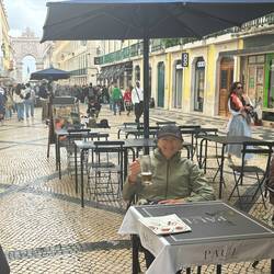 Wetting the whistle with the Arch de Rua Augusta in background