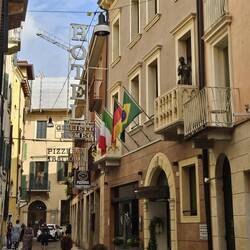 Look carefully at the name of the hotel AND who is on the balcony!