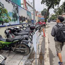 Bikes park on the pavements and pedestrians have to walk in the road!