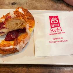 Traditional Danish pastry with custard and raspberry jam