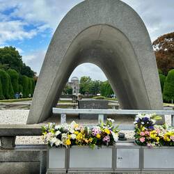 Looking to the Flame of Remembrance,and the ruins of a building now called the A Bomb Dome.