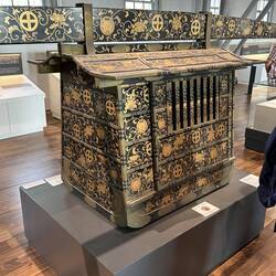 Small, closed in, black and gold lacquered Palanquin