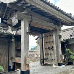 Showing massive doors of the gate into the Sengan-en Garden.