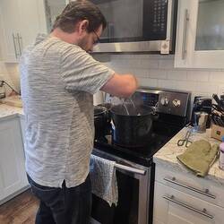 Cory filling the jars
