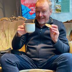 Ian enjoying a Karelian pastry with his morning coffee