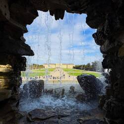 The palace and the Great Parterre from behind the Neptune Fountain ... Schloss Schönbrunn — Vienna.