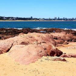 It reminds me of Britanny (France): pink granite blocks.