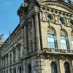Statue of Christopher Columbus to the left of the building