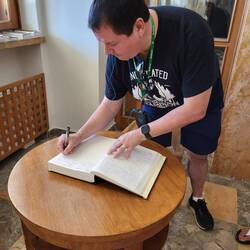 Signing the guest book