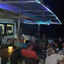 Last night of 4d segment: the captain is sitting in the corner playing guitar & singing; pretty good