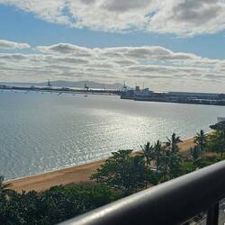 View looking east from our hotel room: harbor, casino, ship yard