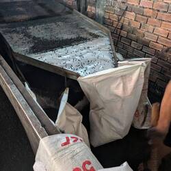 Charcoal chips going into the bags