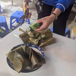 Open the little parcels and cutting the coconut cake