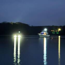 Marina guiding a boat in. They really do go above and beyond here.