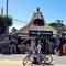 Cycling. Curiosity shop in background. La Barra.
