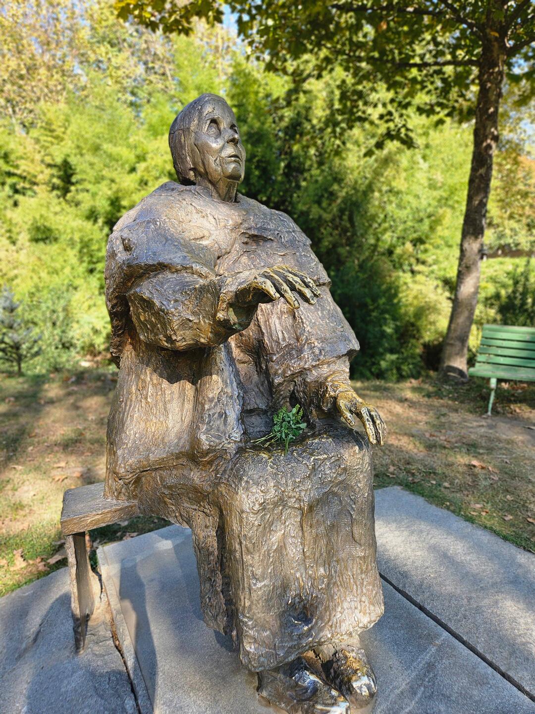 The statue's hands are shiny from visitors' touches