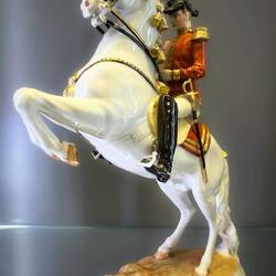 Porcelain Lipizzaner and rider in the display case in the lobby — Winter Riding School in Vienna.