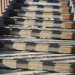 The surfing winners get their name on a stair.