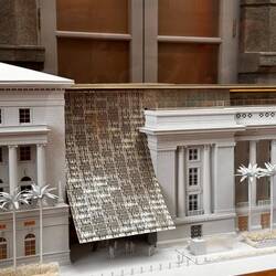 This is a model of the building. The arched structure is supposed to represent a stretched silk clot